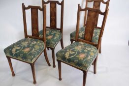 Set of four late Victorian mahogany framed dining chairs, the backs decorated with inlaid Art