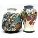 Two Moorcroft vases, one with tube lined design of cherries, the other in the Islay design (2)