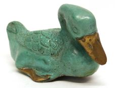 Oriental metal bronze figure of a duck with green painted decoration