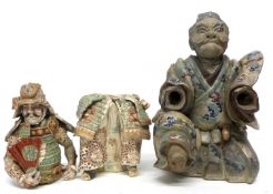 Pottery figure of a Japanese Samurai, together with a further Samurai figure (a/f) (2)