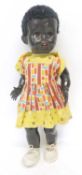 Mid-20th century ethnic doll by Pedigree, in original clothing, doll's head turns and she walks