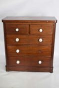 Victorian mahogany chest of two short over three long drawers fitted with white ceramic handles,