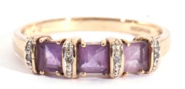 Modern 9ct gold amethyst and diamond ring featuring three square shaped amethysts between four