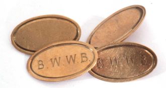 Pair of 9ct gold cuff links of oval shape, one panel on each engraved with 'BWWB', chain connectors,