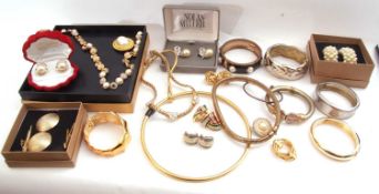 Box of costume jewellery to include bracelets, brooches etc