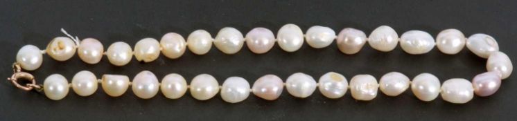 Single row baroque pearl necklace, a row of 32 baroque pearls joined by a 9ct gold bolt ring, 44cm