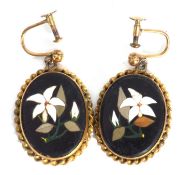 Pair of antique pietra dura earrings, the oval black panels inlaid with white and green stones in
