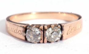 Two-stone diamond ring featuring two old cut diamonds, each individually in coronet settings, raised