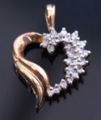 Modern diamond set heart pendant of open work design with one side set with a cluster of small