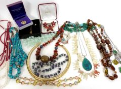Box of costume jewellery to include modern amber bead necklace, a cut-out elephant necklace, various