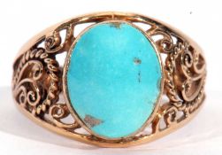Yellow metal and natural turquoise stone ring, the cabochon stone bezel set and raised between