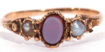Antique sardonyx and pearl ring, the small oval shaped sardonyx centre stone flanked by two small