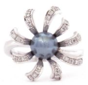 Modern Tahitian grey split pearl and diamond cluster ring, the centre grey pearl 8mm diam within a