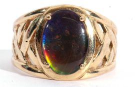 Large 9ct gold designer ring centring an iridescent oval panel, four claw set and raised between