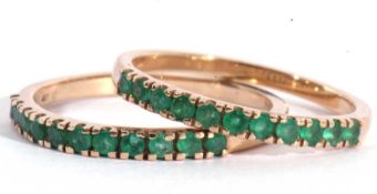 Two modern 9ct gold and emerald half hoop rings, each with 11 small emeralds, size P/Q (2)