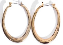 Pair of large yellow metal oval shaped hoop earrings with steel pin fittings, g/w 8.9gms