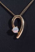 18k stamped opal mounted pendant, a stylised design featuring a small round cut cabochon opal
