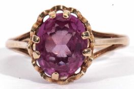 9ct gold amethyst single stone ring, the oval faceted shaped amethyst multi-claw set in a basket
