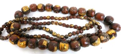 Two unusual large earthenware Tibetan style bead necklaces, large example with drum shaped beads