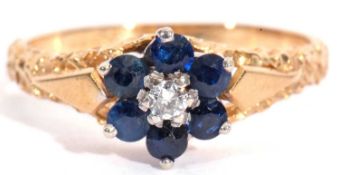 Sapphire and diamond cluster ring, a flowerhead design centring a small brilliant cut diamond,