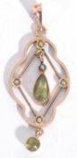 Antique 15ct stamped open work pendant, the centre suspending a peridot tear shaped drop, the