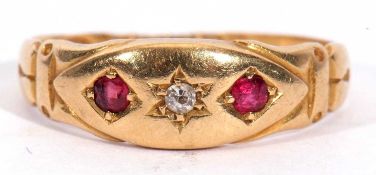 Antique 18ct gold diamond and ruby ring centring a small old cut diamond flanked by two round cut