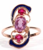 Russian amethyst, enamel and red stone ring centring an oval faceted amethyst raised between two