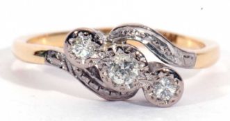 Three stone diamond cross-over ring featuring three old cut diamonds, each in illusion settings,