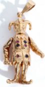 Large 9ct gold court jester pendant, having articulated head, arms and legs, the tunic highlighted