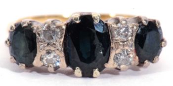 18ct gold sapphire and diamond ring featuring three graduated oval faceted dark sapphires,