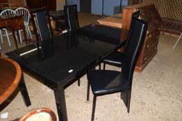 MODERN BLACK GLASS TOPPED EXTENDING DINING TABLE AND FOUR CHAIRS, TABLE 165CM WIDE