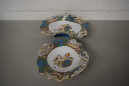 TWO MODERN CONTINENTAL CENTREPIECE BOWLS DECORATED WITH CHERUBS