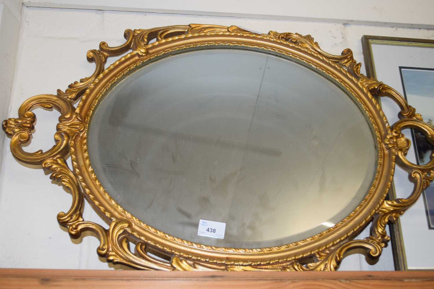 OVAL BEVELLED WALL MIRROR IN A GILT FINISH METAL FRAME