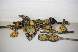 COLLECTION OF ANTIQUE HORSE BRASSES ON LEATHER STRAPS