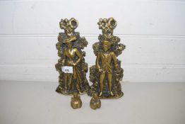 TWO SMALL CAST BRASS DOOR STOPS FORMED AS A LADY AND A GENT TOGETHER WITH TWO SMALL BRASS BELLS (4)