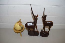 TWO CARVED WOODEN ANTELOPE AND A SMALL MODERN GLOBE