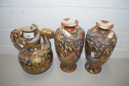 PAIR OF JAPANESE SATSUMA VASES AND A FURTHER SIMILAR JUG, ALL WITH DAMAGE (3)