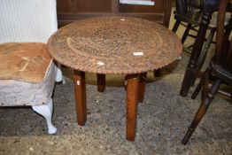 SOUTH EAST ASIAN HARDWOOD TOPPED OCCASIONAL TABLE DECORATED WITH EXTENSIVE CARVED DETAIL