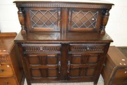 MID-20TH CENTURY DARK OAK COURT CABINET WITH LEAD GLAZED TOP SECTION