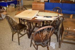 OVAL OAK DROP LEAF DINING TABLE AND SIX WHEEL BACK KITCHEN CHAIRS