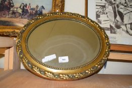 SMALL OVAL BEVELLED MIRROR IN GILT FRAME