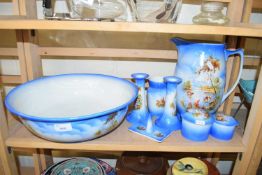 EARLY 20TH CENTURY WASH BOWL, JUG AND DRESSING TABLE SET DECORATED WITH COWS AT RIVERSIDE