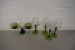 FOUR GREEN STEMMED HOCK GLASSES AND THREE OTHERS