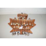 COLLECTION VARIOUS CRESTED COLLECTORS SPOONS ON A MAPLE LEAF SHAPED HOLDER