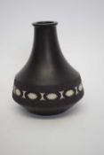 Wedgwood black basalt vase with floral design together with a Moorcroft pin dish, the vase 18cm high