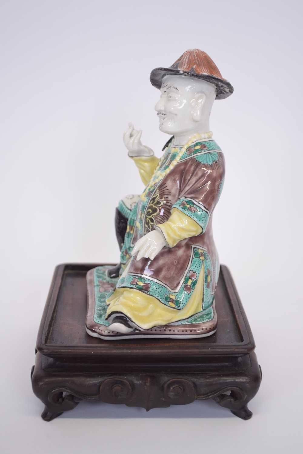 Chinese ceramic figure of a chinaman on wooden base with predominantly famille vert decoration on - Image 2 of 5
