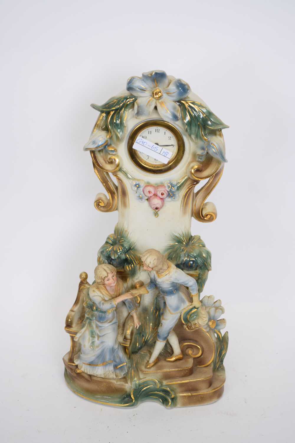 20th century German porcelain cased mantel clock, the case with floral and figural mounts, 40cm