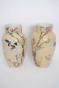 Pair of Japanese porcelain vases decorated with birds on branches, Meiji period with signature to