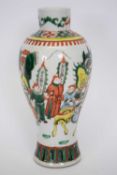 Chinese porcelain vase of baluster shape decorated in famille vert enamels with Chinese figures