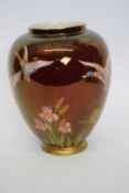 Carlton ware rouge royale vase with flying ducks above floral decoration